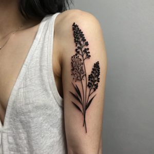 black and white flower back tattoo