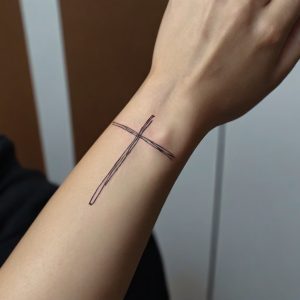 black simple cross tattoo