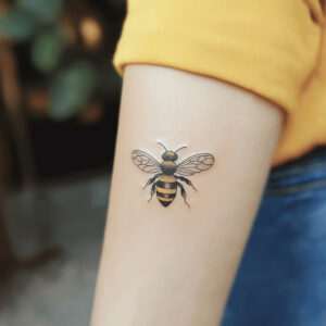 minimalist bee tattoo