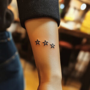 Three star tattoo designs on hand