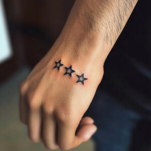 3 star tattoo behind ear