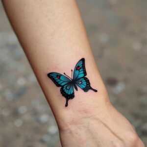 blue butterfly tattoo on wrist