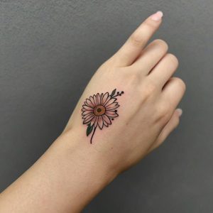 flower on hand tattoo