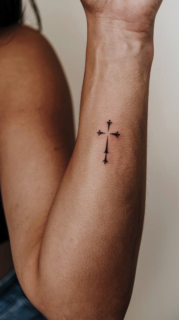 simple cross with flowers tattoo