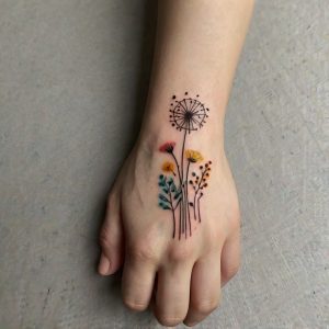 simple flower hand tattoo