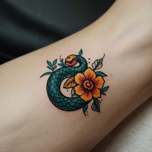 simple snake and flower tattoo