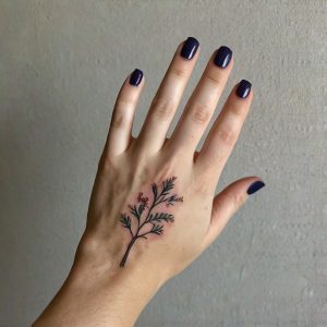 small flower hand tattoos