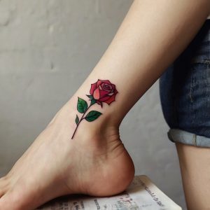 small red rose tattoo