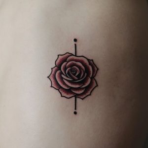 small rose tattoo on wrist