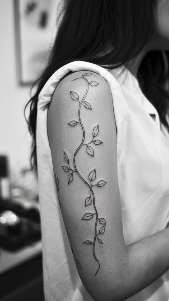 vine arm tattoo