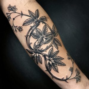 vine wrist tattoo with initials