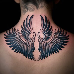 neck wing tattoo