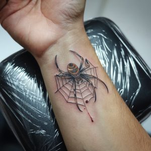 spider web knee tattoo