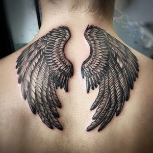 tattoo of wings on neck