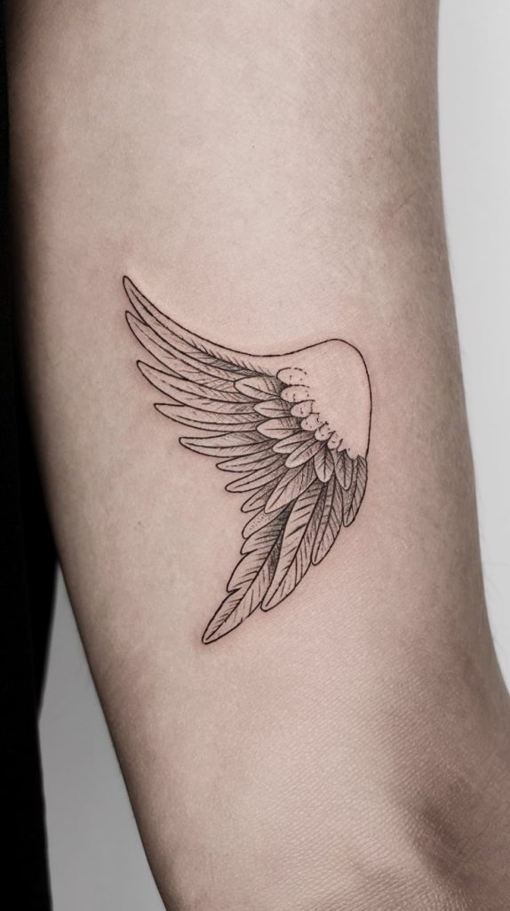 wing forearm tattoo